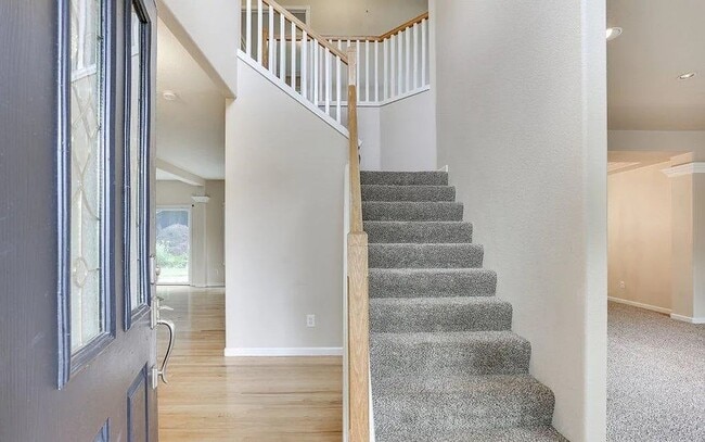 Building Photo - Spacious Four-Bedroom Home with Gourmet Kitchen, Multiple Living Areas, Loft, and Beautifully Lan...