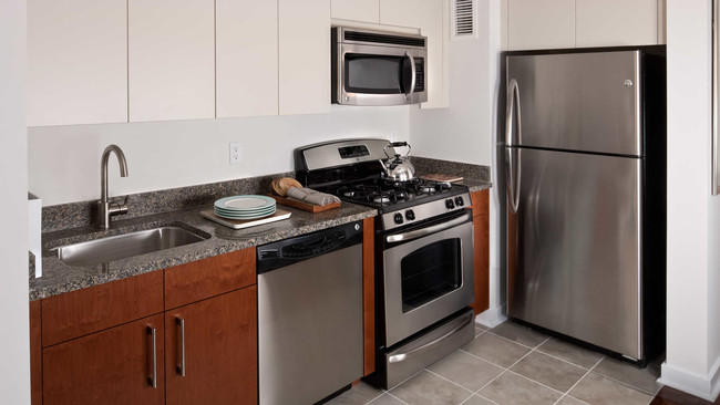 Kitchen with Dishwasher and Stainless Steel Appliances - The Brooklyner