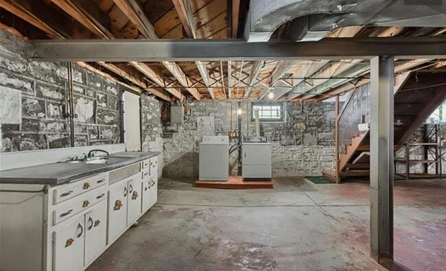 The basement has ample storage space and a washer and dryer. - 5803 Lansdowne Avenue