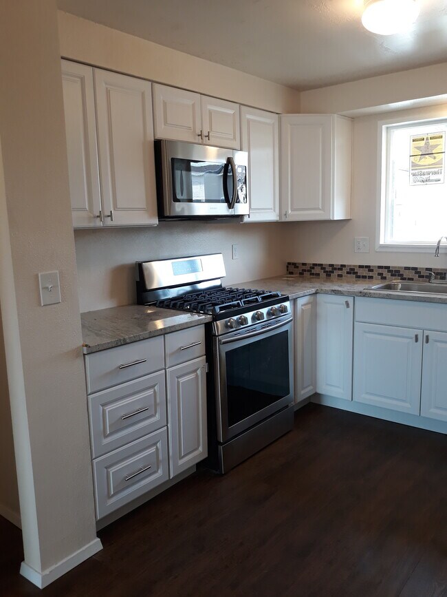 gas range and microwave (both new) - 3782 Black Hills Ave