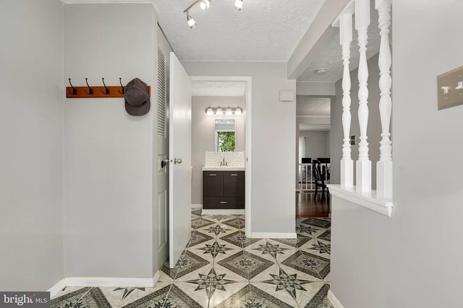 Foyer leads to Half Bath and Living Room - 12504 Timber Hollow Pl