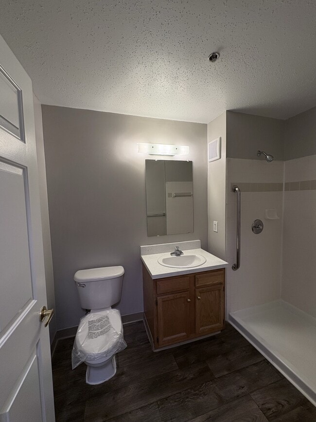 Bathroom with walk-in shower - Kings Crest Senior Apartments