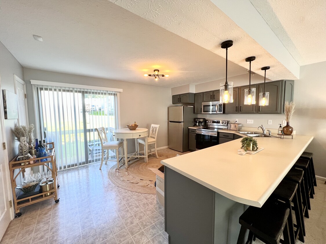 Kitchen with back deck access - 20 Sunridge Dr