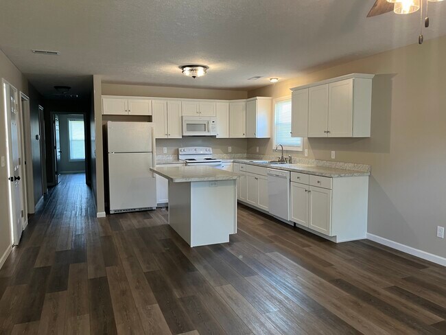 Kitchen with all appliances. Island in the middle. Plenty of storage. - 428 James Ave