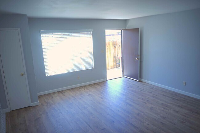 Fresh Flooring, Central Heat and separate AC unit included. New recessed LED lighting in cieling. - 3038 E St