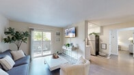Located at 200 Bicentennial Circle in Sacramento, CA, this well-appointed one-bedroom, one-bathroom unit offers a thoughtfully designed layout across a single floor. The living room is a welcoming, light-filled space featuring wood-style flooring, neutral walls, and a sliding glass door that opens to a private balcony, bringing in natural light and outdoor views. Framed wall art and greenery add character to the room, which flows seamlessly into the dining area and kitchen.

The galley-style kitchen is clean and functional, outfitted with white cabinetry extending to the ceiling, stainless steel appliances including a refrigerator and dishwasher, recessed lighting, and a window that keeps the space bright and airy. A peninsula counter provides convenient workspace and a natural transition to the living area.

The bedroom offers a comfortable, serene retreat with wood-style flooring, soft neutral tones, natural light from dual windows, and a spacious walk-in closet with mirrored sliding doors and built-in shelving. The full bathroom is finished with a white vanity, wood-look flooring, and a full shower-tub combination, maintaining the home's clean, cohesive aesthetic throughout. A hallway connects all rooms efficiently, completing this well-organized Sacramento residence.