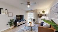 Located at 8010 Woodsedge Drive in Charlotte, NC, this 2-bedroom, 2-bathroom home offers a thoughtfully designed single-floor layout that maximizes both comfort and functionality. Light wood-style flooring flows throughout the main living areas, creating a warm and cohesive aesthetic.

The living room is bright and inviting, featuring a ceiling fan, large window with outdoor views, and neutral walls that complement a relaxed, modern ambiance. Adjacent to it, the galley-style kitchen is well-equipped with stainless steel appliances, white shaker cabinetry, white countertops, and a classic subway tile backsplash. The kitchen opens directly into a dedicated dining area, distinguished by warm-toned accent walls and space for a full dining set.

The primary bedroom offers a comfortable retreat with plush carpeting, a bold accent wall, and access to a walk-in closet. The second bedroom also features carpeting and a window that allows natural light to fill the room. Both bathrooms are finished with white vanity cabinetry, white countertops, wood-style flooring, and shower-tub combinations. A hallway connects the private areas of the home, completing this efficient and well-balanced floor plan.