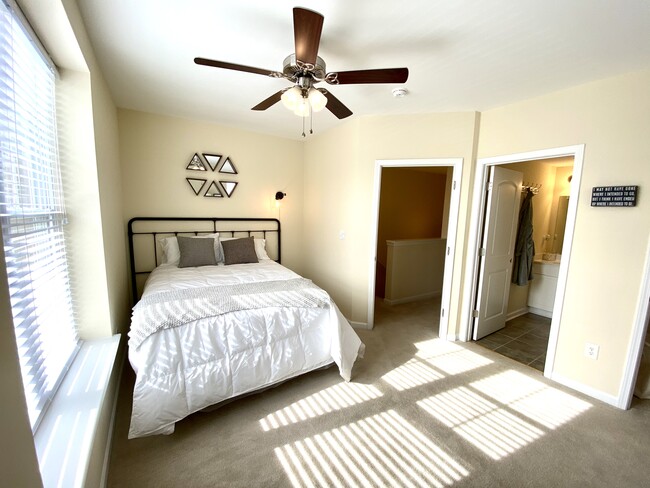 Spacious bedrooms with private bathrooms - The Villages at Town Creek Apartments