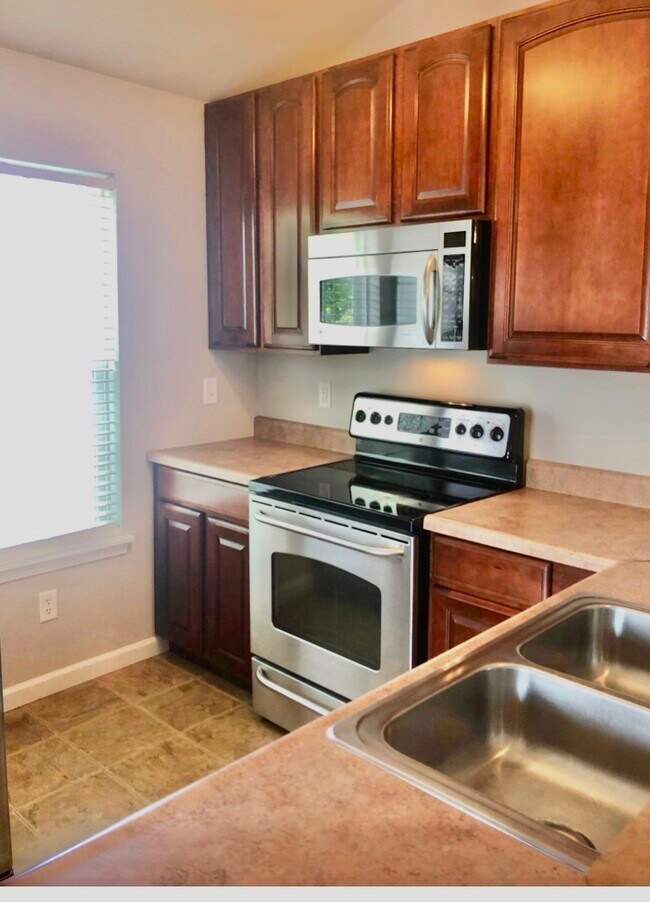 Kitchen with all stainless steel appliances. All electric home. No gas. - 4302 Spring Creek Ln