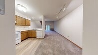 Step into a world where every square foot is an opportunity for elevated living. This delightful duplex presents a unique canvas for your aspirations, with its intelligently designed 570 sq ft spread across two inviting levels. The lower floor, boasting 400 sq ft, sets the stage for your daily life with a seamlessly integrated kitchen and living area. Here, warm wood cabinetry meets sleek white appliances, creating a culinary space that's both functional and aesthetically pleasing.

Ascend the charming staircase to discover 180 sq ft of private retreat on the upper level. The generously sized 130 sq ft bedroom awaits, offering a tranquil sanctuary for rest and relaxation. A strategically placed skylight bathes the space in natural light, adding an airy, open feel to the entire floor.

The bathroom, with its clean lines and modern fixtures, provides a spa-like atmosphere. Ample storage and a large mirror contribute to the sense of spaciousness, while the bathtub offers a perfect spot for unwinding after a long day.

Throughout the home, plush carpeting in neutral tones provides comfort underfoot and complements the crisp white walls, allowing your personal style to shine. Large windows and sliding glass doors not only flood the space with light but also offer picturesque views and easy access to the outdoors, expanding your living area beyond the walls.

This property at 1825 Ludden Dr, Unit 203, isn't just a house – it's a lifestyle choice that combines efficiency, comfort, and style. Whether you're a first-time buyer, downsizing, or seeking a perfect investment property, this duplex offers the canvas for you to paint your dreams. Welcome home to possibilities!