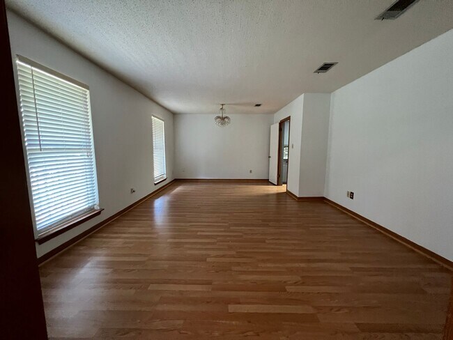 Building Photo - Four bedroom home convenient to bases & sh...