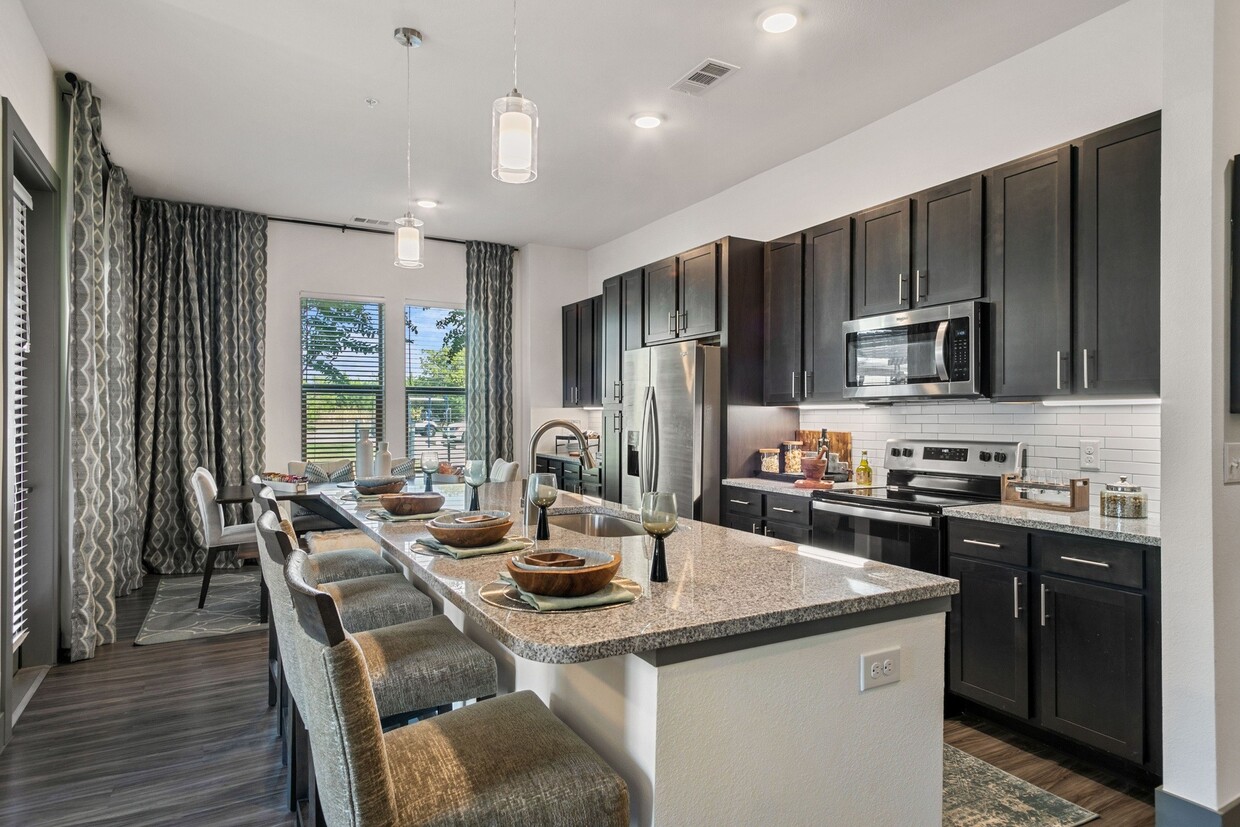 Modern kitchen with elegant finishes. - Windsor Lakeyard District