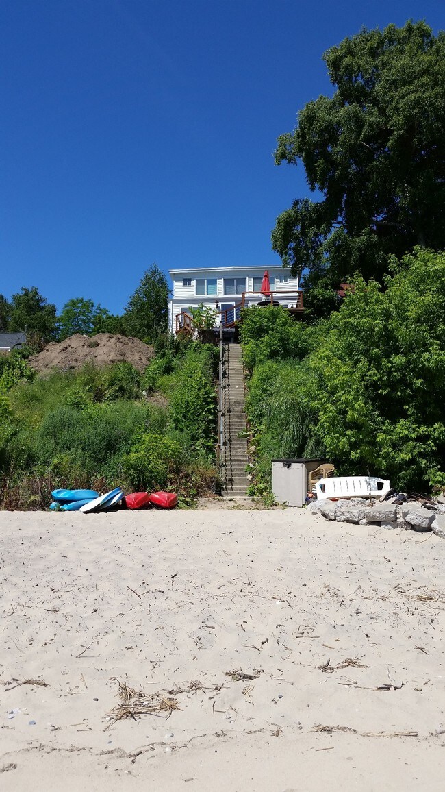 view of main house from the water - 1853 S Lakeshore Rd