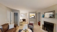 Located at 4601 Baymar Dr in Raleigh, NC, this single-story home offers a well-connected and comfortable layout designed for easy living. The living room serves as the heart of the home, centered around a classic white fireplace with a decorative mantel and flanked by built-in shelving — an ideal display area for décor and personal accents. Plush carpeting throughout the main living areas adds warmth and comfort underfoot.

The open flow of the space transitions naturally from the living room into a dedicated dining area, illuminated by a tasteful pendant chandelier that adds a touch of elegance. Adjacent to the dining area, the kitchen features warm wood-toned cabinetry, dark countertops, and a pass-through window that maintains visual connectivity between the kitchen and the living spaces — a practical and inviting touch.

A spacious closet with rod and shelf storage is conveniently accessible near the main living area, providing ample organizational space. The neutral color palette of soft grays and warm whites throughout creates a clean, inviting ambiance that complements a variety of décor styles. With its thoughtful layout and functional features, this Raleigh home presents a comfortable and cohesive living environment.