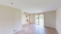 Located at 2801 Stonebridge Boulevard in New Castle, Delaware, this two-bedroom, two-bathroom single-floor unit offers a well-organized layout with a clean, neutral aesthetic throughout. The living room is bright and open, featuring light wood-style flooring, a ceiling fan, and a sliding glass door that fills the space with natural light and provides views of the surrounding greenery. The kitchen is thoughtfully designed with wood-toned cabinetry, light countertops, a stainless steel sink, and white appliances, including a full-size refrigerator and dishwasher. A dedicated laundry room off the kitchen adds everyday convenience with an in-unit washer included. Both bedrooms are carpeted and generously proportioned, with large windows that invite natural light. The primary bedroom offers a comfortable footprint with easy access to the hallway. The two bathrooms are clean and functional — one featuring a full soaking tub with shower combination, and the other a glass-enclosed walk-in shower. Soft, warm wall tones carry throughout the home, creating a cohesive and welcoming ambiance. The overall layout is practical and efficient, making thoughtful use of every area within the home.
