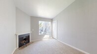 Located at 7434 Auburn Oaks Ct in Citrus Heights, CA, this efficiently designed one-bedroom, one-bathroom home offers a thoughtful layout across a single floor. The living room serves as the centerpiece of the space, highlighted by vaulted ceilings that enhance the sense of openness, a classic fireplace with a white mantle, neutral carpet flooring, and a large window fitted with vertical blinds that invites an abundance of natural light. The combined kitchen and dining area is well-appointed, featuring white cabinetry with modern hardware, granite-style countertops, a double-basin stainless steel sink, and a full suite of stainless steel appliances including a refrigerator, range, microwave, and dishwasher. Wood-look flooring runs throughout the kitchen, adding warmth and contrast. The bedroom offers comfortable carpeting, neutral wall tones, and a window with an outdoor view, creating a calm and restful retreat. A dedicated closet provides practical storage. The bathroom is clean and functional, complete with a tub/shower combo, a vanity with dark countertops, and wood-look flooring. In-unit laundry adds everyday convenience to this well-maintained Citrus Heights home.