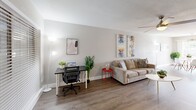 Located at 9401 Mixon Dr in Dallas, TX, this single-floor residence offers 2 bedrooms, 3 bathrooms, and an efficiently designed layout with a clean, modern aesthetic throughout. The living room is a bright, open space featuring wood-look flooring, neutral walls, and a ceiling fan. Large windows allow natural light to fill the room, creating a welcoming atmosphere suitable for both relaxing and working from home. Adjacent to the living area, the dining room benefits from a full sliding glass door that opens to an outdoor patio, offering views of surrounding greenery and allowing natural light to flood the space. The kitchen is well-appointed with white shaker cabinets, a gray geometric tile backsplash, white quartz countertops, and a full suite of stainless steel appliances including a gas range, microwave, dishwasher, and refrigerator. The primary bedroom is a generously sized retreat with dark hardwood-style flooring, a dedicated closet, and access to its own bathroom. The second bedroom features a ceiling fan, a closet, and the same warm flooring found throughout the home. Bathrooms are finished with large-format gray tile surrounds in the tub and shower areas. With six closets total, storage is plentiful throughout this well-designed Dallas home.