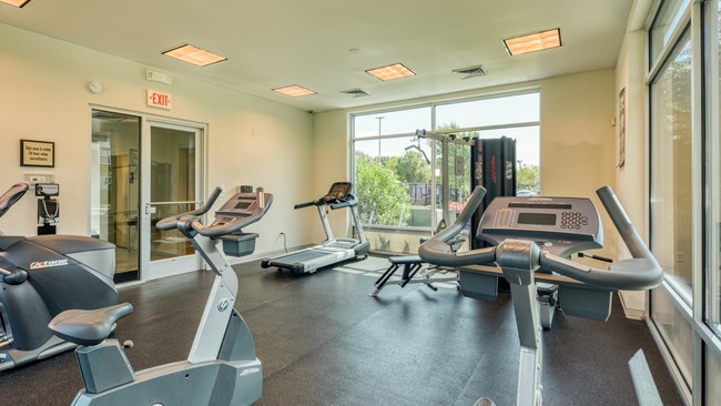 Fitness center features state-of-the-art equipment - Mission College Apartments