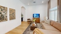 Located at 330 Homestead Parkway in Camp Verde, Arizona, this one-bedroom, one-bathroom residence offers a thoughtfully designed single-floor layout with a clean, modern aesthetic throughout. Light wood flooring flows continuously across all rooms, creating a cohesive and warm atmosphere.

The living room is a welcoming space featuring elevated ceilings, recessed lighting, and a distinctive arched entryway that adds architectural character. Large windows dressed with layered curtains invite ample natural light while maintaining privacy.

The kitchen is well-appointed with white shaker cabinetry, white subway tile backsplash, quartz countertops, and a full suite of stainless steel appliances. A sliding glass door opens directly to a private outdoor patio, seamlessly connecting indoor and outdoor living.

The bedroom is a comfortable, well-lit retreat with multiple windows, elegant draping curtains, and a sliding-door closet providing organized storage. The room's neutral palette contributes to a calm, restful ambiance.

The bathroom maintains the home's clean design language with white cabinetry, a vanity with ample counter space, and a natural light source via a frosted window. A hallway connects the key areas of the home efficiently. This residence offers a complete and functional living experience in a compact, modern package.
