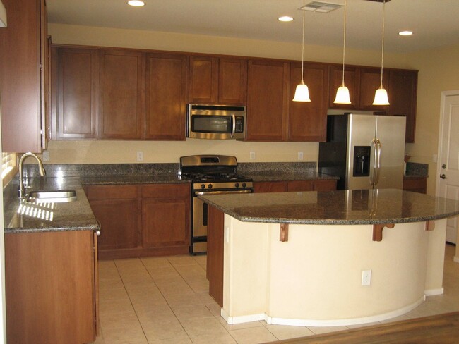 Building Photo - 4 Bedrooms, 2.5 Baths, 2 Car Garage, All a...