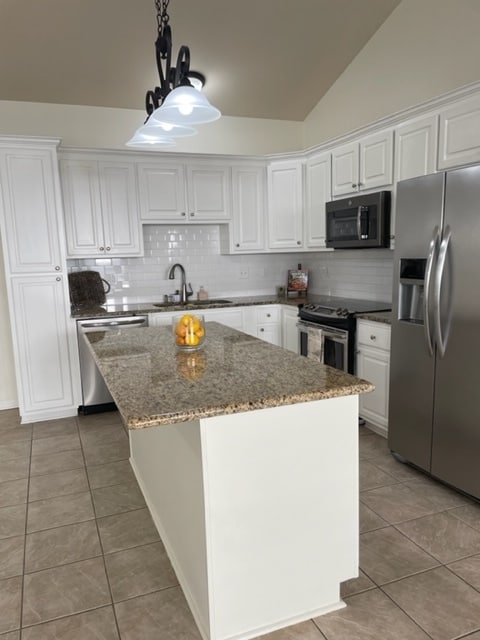 kitchen island area-stainless appliances - 15015 Banff Ct