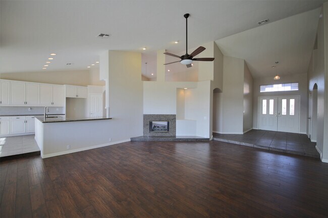 Building Photo - STUNNING single story home in serene gated...