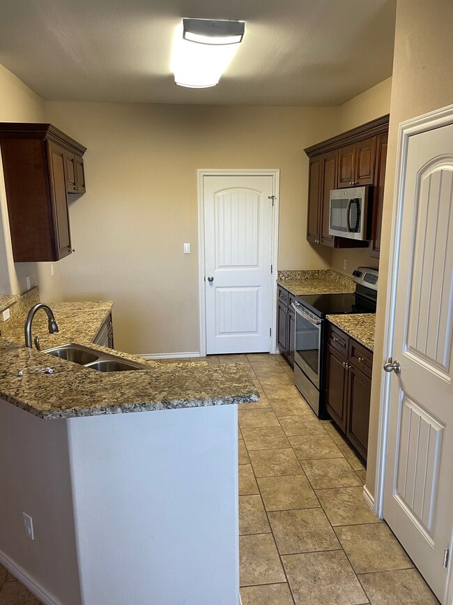 kitchen with granite (fridge IS included) - 404 E 19th St