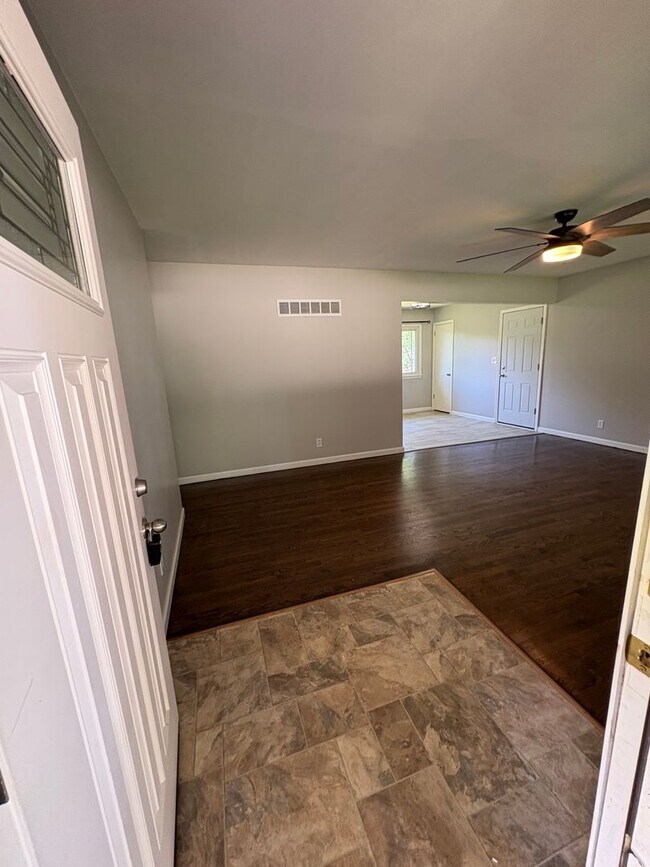 Building Photo - Spacious 4 Bed / 2.5 Bath Home on Nearly 3/4 Acre Lot with Walkout Basement and Multiple Living A...