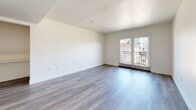 Located at 5220 Harmony Ave in the North Hollywood neighborhood of Los Angeles, this single-floor, 4-bedroom, 2-bathroom home offers a clean, modern aesthetic with consistent design throughout. The open-concept kitchen and living area serves as the heart of the home, featuring white shaker cabinets, granite-look countertops, and stainless steel appliances including a refrigerator and gas range. Wood-look luxury vinyl flooring runs seamlessly throughout every room, contributing to a cohesive and contemporary feel. The spacious living room is highlighted by French doors that open to a private balcony, allowing for abundant natural light and outdoor views. Four well-proportioned bedrooms offer neutral white walls and windows with vertical blinds, with the primary bedroom providing a comfortable, dedicated retreat. Bedrooms include sliding closet storage. The two bathrooms are finished with matching wood-look flooring, granite-topped vanities, and clean white walls. One bathroom features an open, accessible vanity design. A central hallway connects all rooms efficiently, and the overall floor plan, as seen in the 3D model, is thoughtfully laid out for functional everyday living.