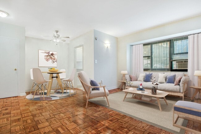 Studio apartment living and dining area (virtually staged) - The Diplomat