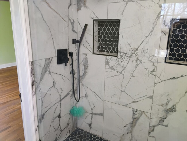 Porcelain walk-in showers. - 821 S William St