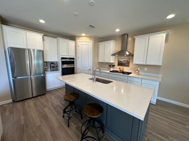 Building Photo - One year old, 3 bedroom, 2.5 bath surround...