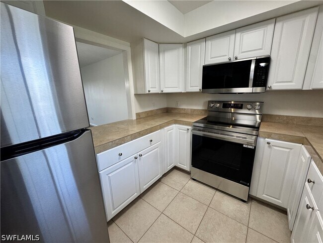 Building Photo - 12250 Tamiami Trl E