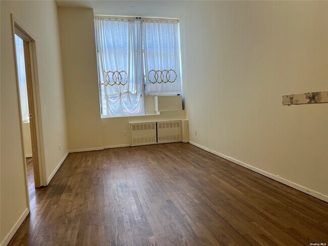 Building Photo - 61-20 Woodside Ave