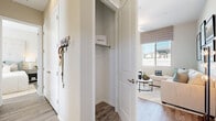 Located at 9200 W McDowell in Phoenix, AZ, this single-story home offers a thoughtfully designed open-concept layout that seamlessly connects the main living areas. The kitchen is a standout feature, outfitted with crisp white cabinetry, granite-look countertops, and a full suite of stainless steel appliances including a refrigerator with ice maker, electric range, over-the-range microwave, and dishwasher. A peninsula with bar seating provides additional prep space and a casual dining option, while a nearby window and door invite abundant natural light and outdoor views. The living area is bright and welcoming, with large windows dressed in Roman shades and horizontal blinds that allow for flexible light control. Wood-look plank flooring flows consistently throughout the home, enhancing its cohesive, contemporary aesthetic. The bedrooms are comfortably sized and feature closets with built-in shelving and hanging rods. The bathroom is well-appointed with white cabinetry, granite-look countertops, wood-look flooring, a walk-in shower with glass enclosure, and a window that brings in natural light. A dedicated entryway closet and wall-mounted hooks offer practical storage near the front of the home, adding to the overall functionality of this well-planned residence.