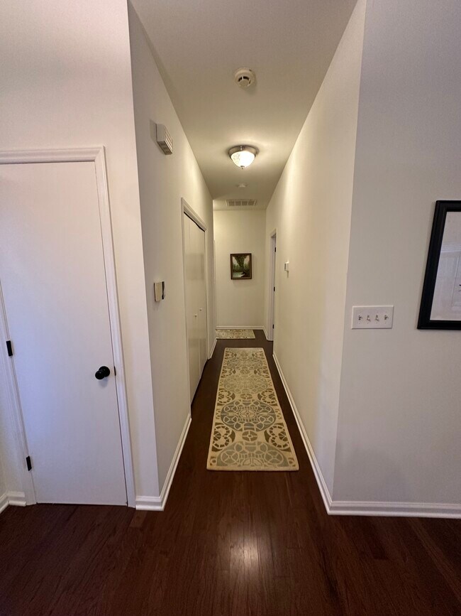 hallway to bedrooms and laundry closet - 3201 Gulfstream Ct