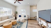 Located in Sacramento, CA, this well-appointed two-story home offers 3 bedrooms, 4 bathrooms, and a thoughtfully distributed layout across two floors of nearly equal size. Light hardwood-style flooring runs throughout the home, creating a cohesive and modern aesthetic.

The main floor hosts a bright, open living room featuring recessed lighting, a ceiling fan, and multiple windows that invite ample natural light. The kitchen is a functional centerpiece, boasting rich warm-toned cabinetry, granite countertops, stainless steel appliances including a refrigerator, range, microwave, and dishwasher, and a window above the sink. An adjacent dining area provides convenient everyday use. A utility room and a well-appointed bathroom with granite vanity round out the first floor.

Upstairs, three bedrooms offer comfortable retreats, including a primary bedroom with a ceiling fan, a large window, and closet access. Additional bedrooms feature hardwood-style flooring, closet storage, and clean, neutral walls. The upper level is served by multiple bathrooms, including one with a sliding glass-door shower enclosure. Two hallways connect the rooms efficiently on both floors, and two closets provide additional storage throughout the home.