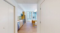 This contemporary townhouse in Baltimore offers 1080 square feet of thoughtfully designed living space across two floors. The home features 2 bedrooms and 3 bathrooms, including a spacious 180 square foot primary bedroom. The open-concept main living area combines the kitchen and living room, creating an ideal space for entertaining. 

The kitchen boasts modern cabinetry, stainless steel appliances, and a stylish green tile backsplash. Large windows throughout flood the space with natural light, enhancing the airy feel of the home. The bathrooms are clean and contemporary, with floating vanities and ample storage.

Hardwood floors run throughout, adding warmth to the crisp white walls. The property's layout includes an entrance, two hallways, and a closet for additional storage. With its sleek finishes and functional design, this townhouse offers a perfect blend of style and comfort in the heart of Baltimore.