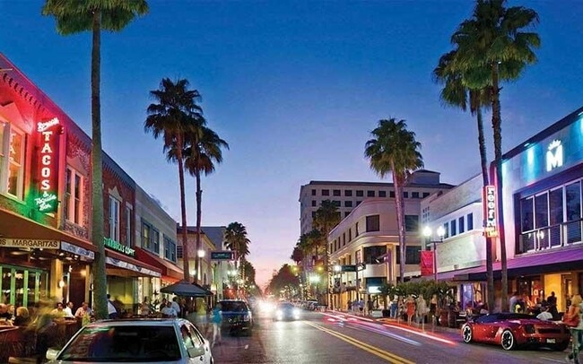 Explore the vibrant atmosphere surrounding Ponte Verde Apartments at Palm Beach Lakes, where lively streets blend with palm-lined avenues. Enjoy local dining, shopping, and entertainment just steps from your door. Come see your future lifestyle today! - Ponte Verde Apartments At Palm Beach Lakes