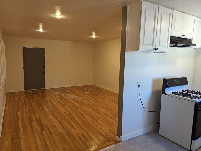 view from kitchen to living room - 3406 McManus Ave
