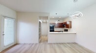 Located at 4414 Point Blvd in Garland, TX, this single-story, 2-bedroom, 1-bathroom residence offers a clean, modern aesthetic throughout. Light wood-style flooring runs continuously across all rooms, creating a cohesive and airy feel.

The combined kitchen and living room forms the heart of the home. The living area features a classic white-surround fireplace and a large window with vertical blinds that invite natural light. The kitchen is equipped with rich, dark wood cabinetry, light countertops, stainless steel appliances including a refrigerator, electric range, and dishwasher, and a single-basin sink—making it both functional and stylish.

The primary bedroom is a comfortable, well-proportioned space with a ceiling fan, a window with blinds, and direct access to a walk-in closet outfitted with built-in shelving. The second bedroom is bright and versatile, featuring dual windows for ample natural light. Both rooms are finished with neutral walls that complement the light flooring.

The full bathroom includes a tiled tub-shower combination with chrome fixtures, maintaining a clean, simple design. A hallway connects all rooms efficiently. The walk-in closet provides generous storage. Throughout, recessed lighting and neutral tones contribute to a bright, move-in-ready atmosphere.