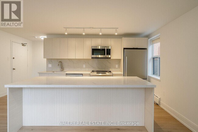 Photo du bâtiment - 111 Cosburn Ave.