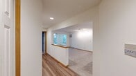 This well-appointed apartment offers 1060 square feet of living space on a single floor, featuring three bedrooms and two full bathrooms. The kitchen is a highlight, boasting rich wooden cabinetry, sleek granite countertops, and modern stainless steel appliances. Tile flooring in the kitchen and bathrooms contrasts with plush carpeting in the bedrooms and living areas, creating a balanced aesthetic throughout.

The primary bedroom, measuring 180 square feet, provides ample space for rest and relaxation. Large windows in the bedrooms and living areas flood the space with natural light, while ceiling fans offer additional comfort. A notable feature is the sliding glass door leading to an outdoor area, perfect for enjoying fresh air or taking in the view.

Both bathrooms are equipped with modern fixtures, including combination shower-tubs with curved shower rods for added space. The apartment's open layout facilitates easy movement between rooms, with the dining area seamlessly connecting to the kitchen. Ample closet space is available throughout, ensuring plenty of storage options.

The apartment's neutral color palette provides a blank canvas for personal styling, while the mix of materials – from the warmth of the wooden trim to the cool tones of the granite – adds visual interest and texture to the space.