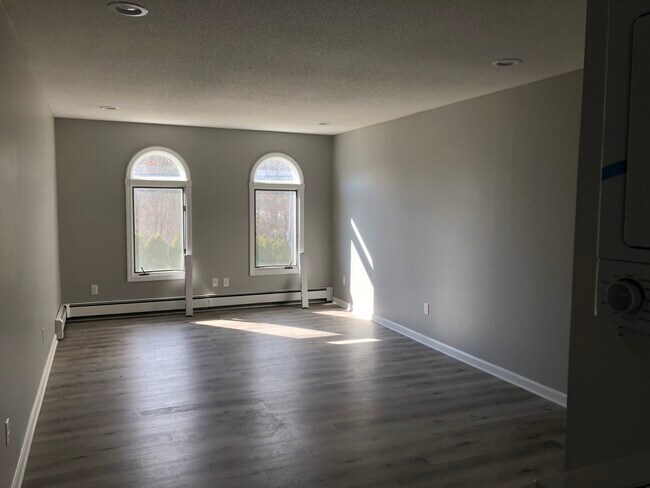 Living room new vinyl flooring - 54 East Ave