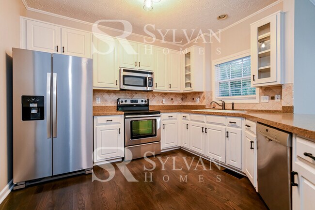 Building Photo - Welcome to this charming abode.