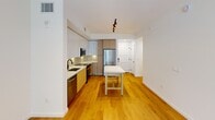 This contemporary 650 square foot apartment in North Miami offers a harmonious blend of style and functionality. The open-concept layout features a sleek kitchen with two-tone cabinetry, stainless steel appliances, and a convenient island, perfect for casual dining or food preparation. The living area, adorned with warm wooden floors, seamlessly connects to the kitchen, creating an inviting space for relaxation and entertainment.

The bedroom, measuring 140 square feet, provides a tranquil retreat with large windows that allow natural light to flood the space, offering views of the lush surroundings. The luxurious bathroom boasts marble-inspired tiles, a spacious walk-in shower, and a modern vanity with ample storage.

Throughout the apartment, recessed lighting and track fixtures provide adjustable illumination, while the neutral color palette creates a canvas for personal style. Two closets offer generous storage solutions. The property is part of a larger complex that includes a beautifully landscaped tropical courtyard with palm trees and a serene water feature, providing residents with a resort-like atmosphere. This efficient one-bedroom unit maximizes space and comfort, making it an ideal urban oasis in the heart of North Miami.