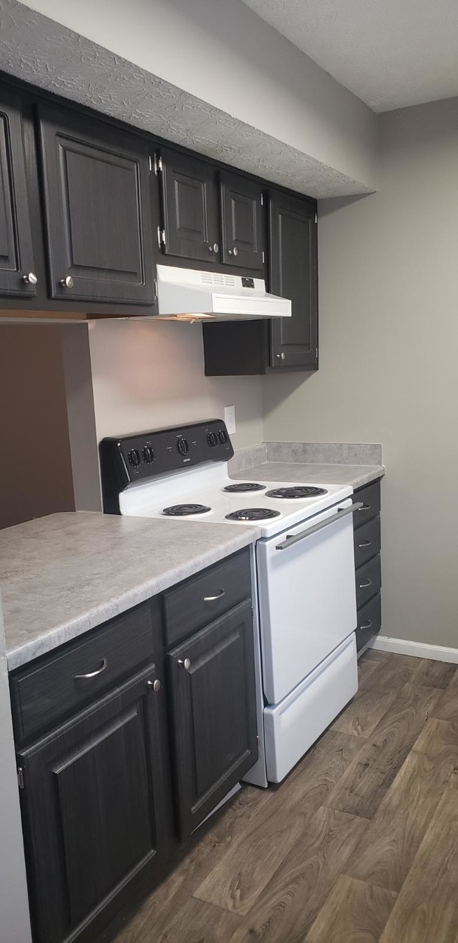 updated townhome kitchen - Rocky Creek Apartments