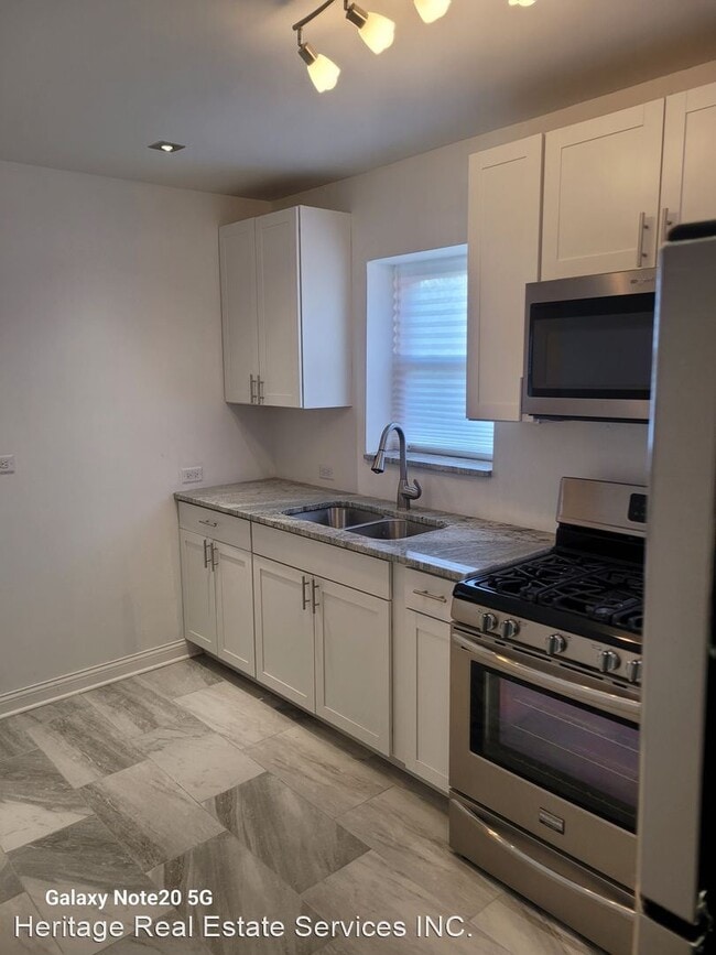 Building Photo - 3 br, 2.5 bath House - 2559 W. 12th S Ave.,
