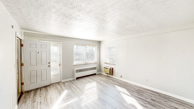 Living Room w/New Luxury Vinyl Plank (LVP) Flooring. Living Room Walks-Out to Concrete Balcony - 2724 Montana Ave