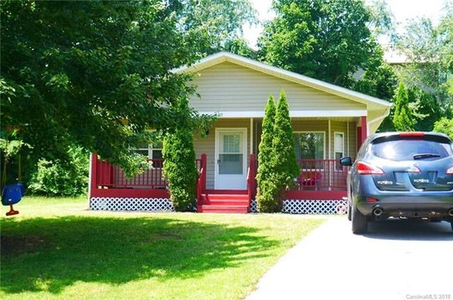 Fantastic front porch can comfortably accommodate outdoor furniture and grill. - 26 Wilson Creek Dr